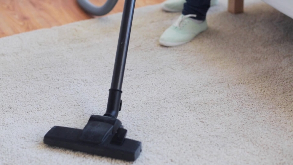Woman With Vacuum Cleaner Cleaning Carpet At Home 44 alt