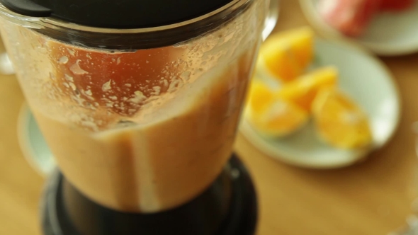 Cooking Smoothies in a Blender of Fruit and Vegetables