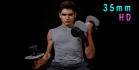 Young Man Working Out With Dumbbells 18
