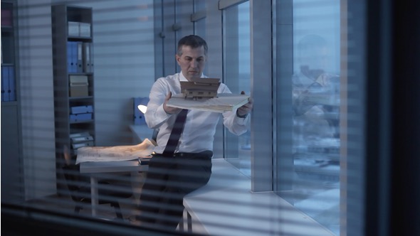 Engineer, Architect Stays Late at the Office alt