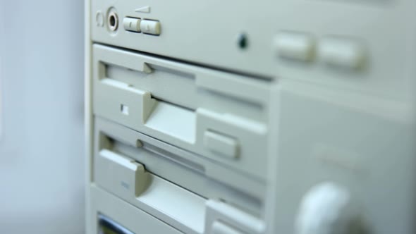 Inserting Diskette Into Retro Computer