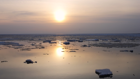   Sunset. Ice Drift On The River. In The Spring The Ice Floats