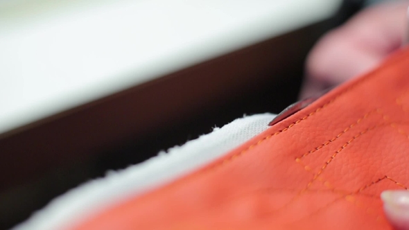 Seamstress Cuts a Piece Of Cloth