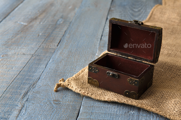 Wooden chest or trunk at serenity wood background