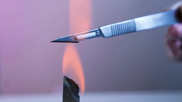 Scalpel And Forceps Sterilization With Fire alt