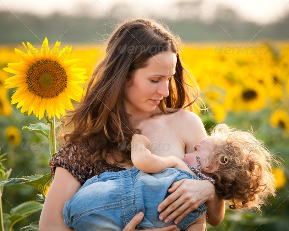 Woman breastfeeding baby - Stock Photo - Images