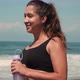 Female Running Along Sandy Ocean Coastline - VideoHive Item for Sale