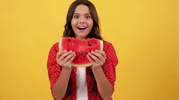 Amazed Kid Showing Slice of Watermelon Fruit on Yellow Background Selective Focus Yummy alt