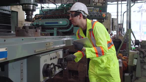 Smart Factory Worker Using Machine in Factory Workshop alt