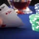 Two Aces In Hand And Gambling Chips On Casino Blue Felt - VideoHive Item for Sale