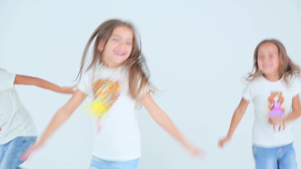 Little Girls Dancing On a White Background