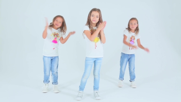 Little Girls Dancing On a White Background
