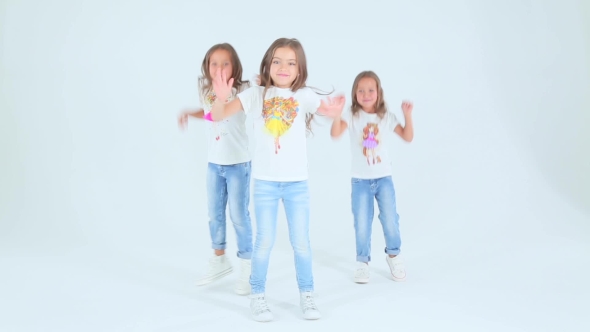 Little Girls Dancing On a White Background