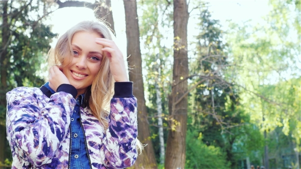 Portrait of an Attractive Woman: Smiling and Flirting at the Camera alt