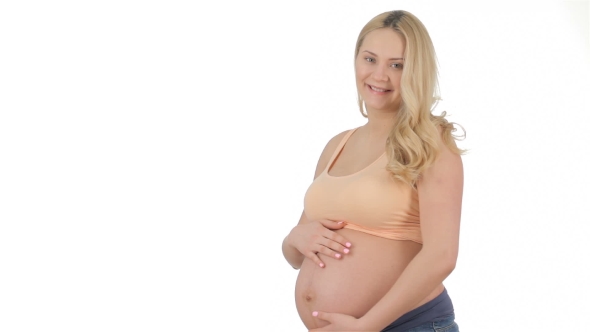 Pregnant Woman Caresses Her Belly alt