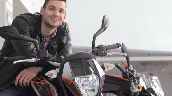 Man Sitting On Motorbike alt