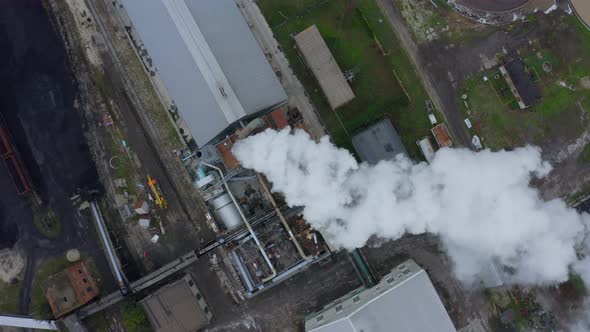 Top View of the Smoke Coming From the Factory Chimney Olluting the Air alt
