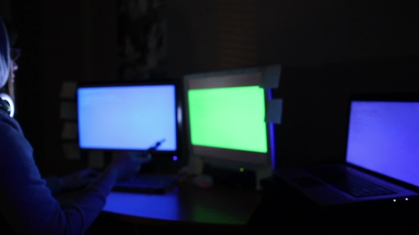 Hacker Girl Works At The Computer And Smoking Electronic Cigarette