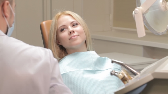 Woman Receive Checkup At The Dentist alt