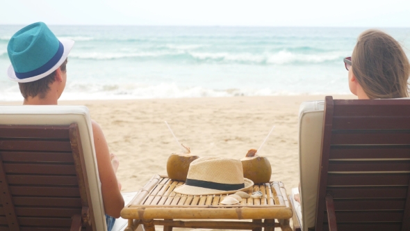 Caucasian Man And Woman In Love Sitting In Beach Chairs, Stock Footage