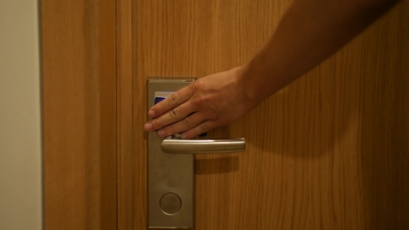 Lifestyle Man Open Hotel Door With Security Card Key And Enter In Room alt