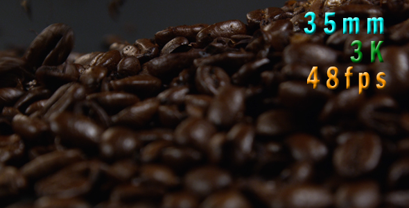 Coffee beans falling on a black table 32
