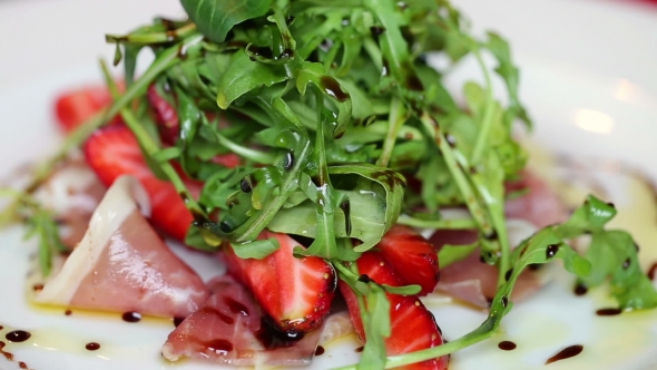 Arugula With Strawberries And Slices Of Ham In Sweet Sauce