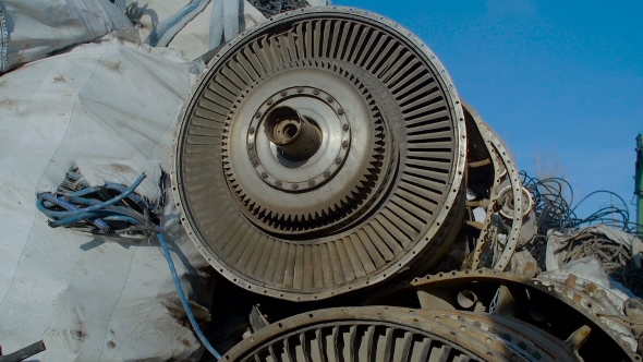 Broken Turbine Among Scrap Metal alt
