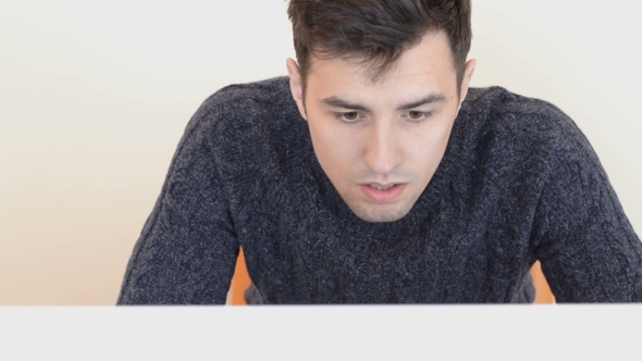 Tired And Disheveled Man Is Working On Computer alt