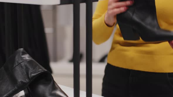 Mature Caucasian Woman Customer in Clothing Store Shopping Discounts Sale Focused Elegant Middleaged alt