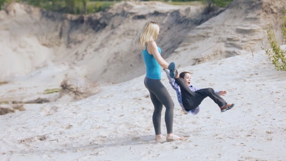 Young Mother And Son Holding Hands Circling alt