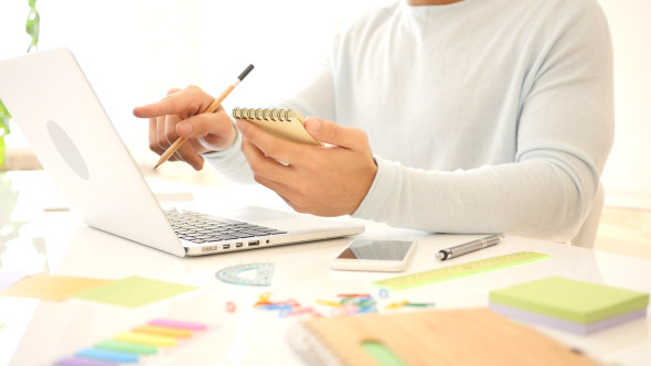 Creative Freelance Designer Working and Writing alt