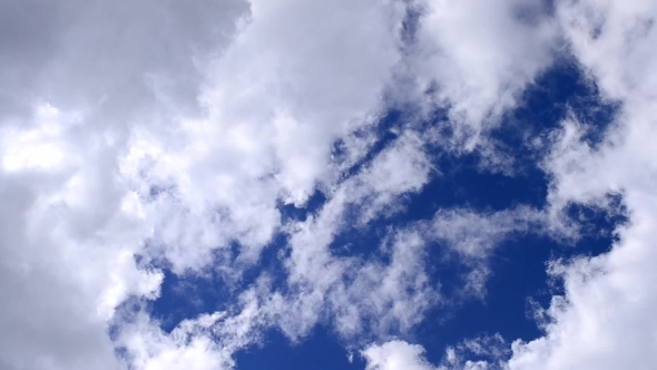 Beautiful White Cumulus Clouds Moving In Blue Sky