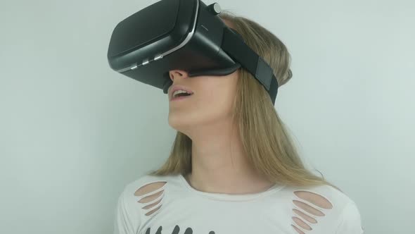 Young Sexy Woman Using Modern Helmet Virtual Reality And Full Immersion Technology