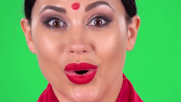 Portrait of Beautiful Indian Girl Is Looking at the Camera with Shocked and Surprised Wow Face alt