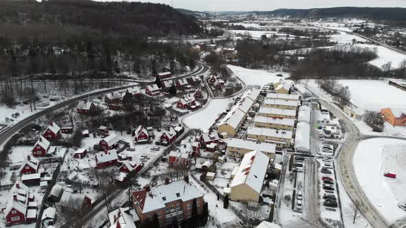 Charming Snowy Industrial Community Residential Area Aerial Pullback alt
