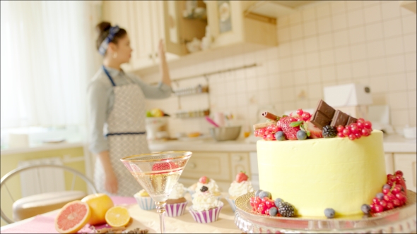 Girl Drinking Champagne In The Kitchen After Cooking alt