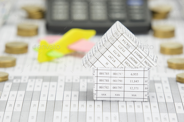 Close up house have blur airplane and calculator as background