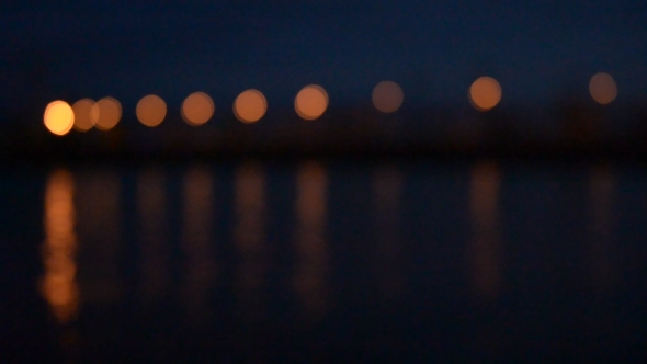 Road Lights Reflected In Water At Night