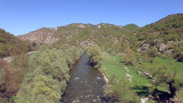Flying Over The River With Mani Trees And Pure Sky
