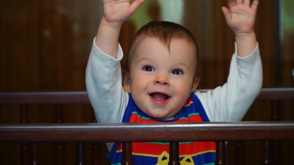 Footage Nine-Month Boy Playing In Crib