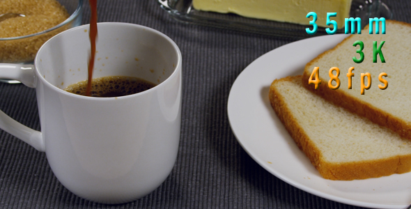 Coffee Being Poured Next To Buttered Toast On a Plate 21