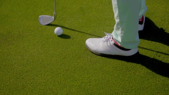 Woman Golfer Wearing Golfing Shoes alt