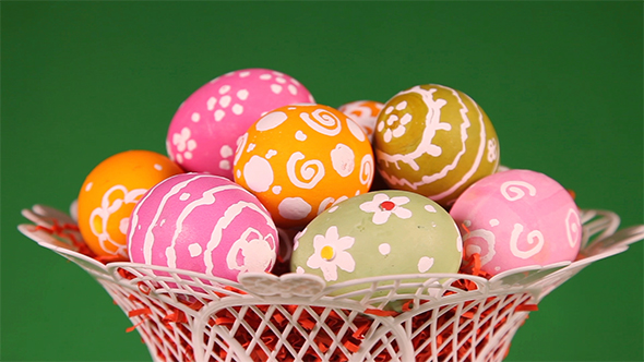 Easter Eggs in Basket on Green