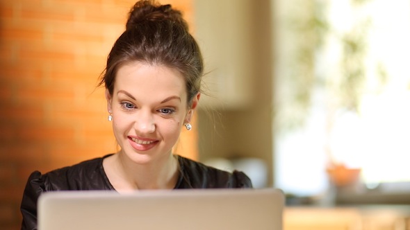 Cute Girl Behind Her Laptop