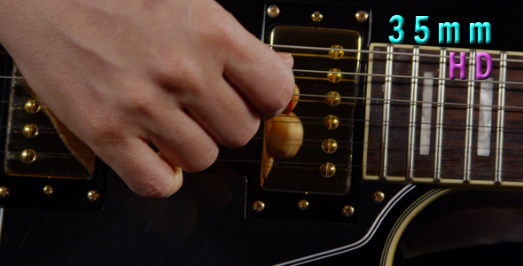 Hand Playing Black Electric Guitar 18