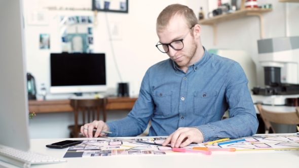 Stylish Architect Working On Blueprint alt