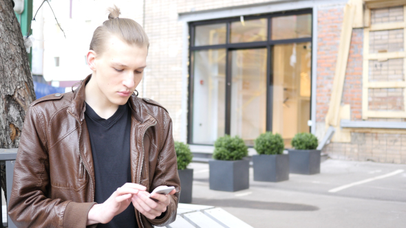 Using Phone while Sitting on Bench alt