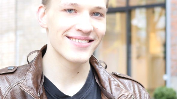 Portrait of Smiling Young Man alt