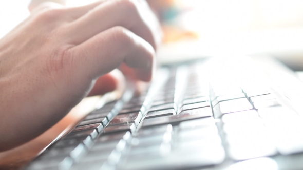 Hands Of Man Typing On Black Keyboard